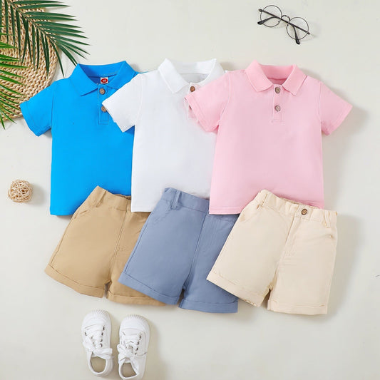 A flat lay of soft, colorful baby clothes and accessories, including bodysuits, pajamas, and hats, showcasing gentle fabrics and playful prints.