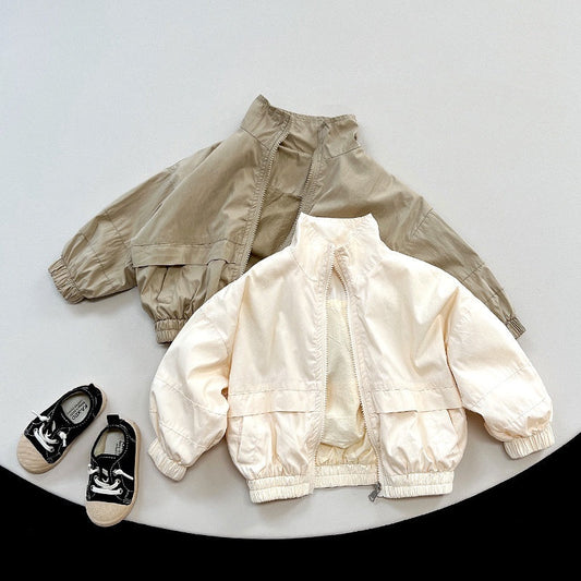 A peaceful nursery with a softly lit crib, plush blanket, gentle white noise machine, and cozy sleepwear creating a calm sleep environment for baby.