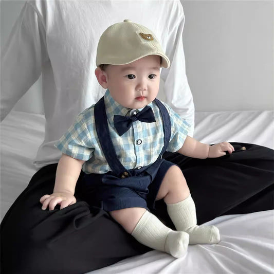 A smiling baby in a cozy outfit is gently fed with a small spoon, surrounded by soft toys and colorful baby essentials in a bright, nurturing space.
