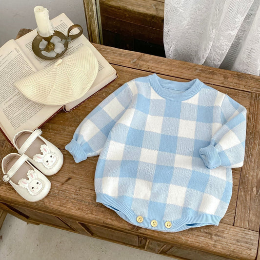 A cozy, neutral baby nursery with a crib made up with soft, fitted bedding, no loose blankets or toys, creating a safe and serene sleep environment.