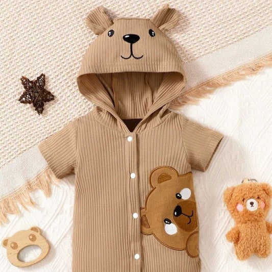 Soft, organic baby clothing, cozy blankets, plush toys, and gentle essentials beautifully arranged in a serene, light-filled nursery setting.