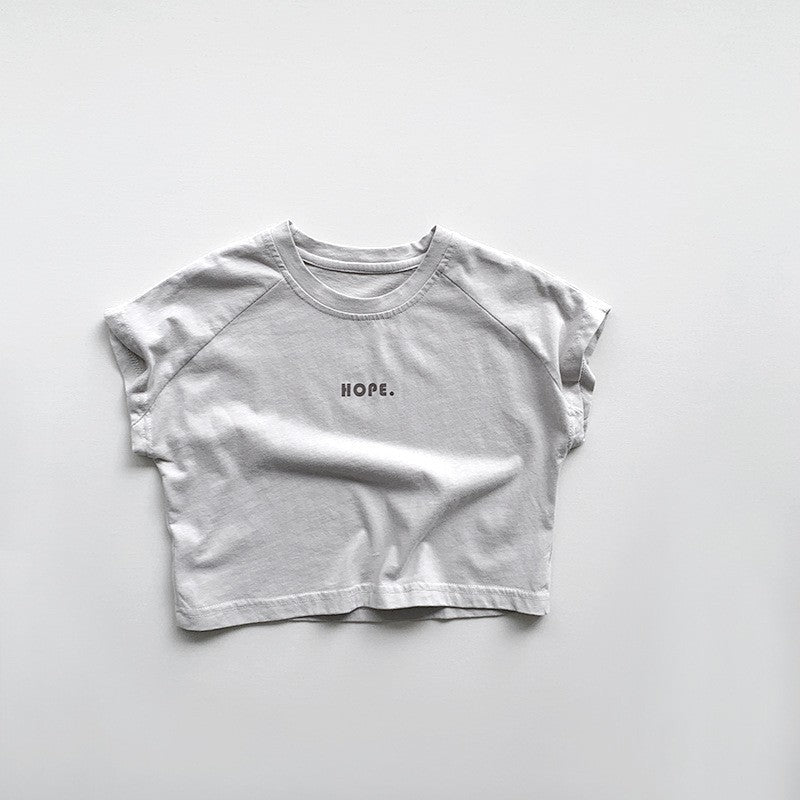 Smiling parent gently bottle-feeds calm baby in cozy nursery, highlighting peaceful feeding time and comfort, thanks to anti-colic bottle design.