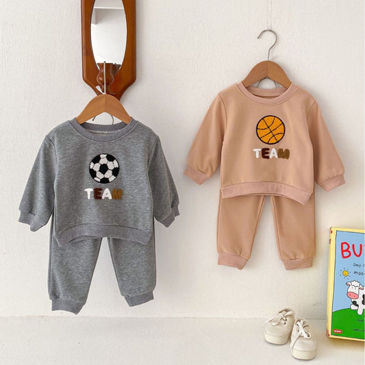 A parent gently placing their baby in a cozy crib, soft light filling the nursery with a white noise machine nearby, creating a peaceful sleep environment.