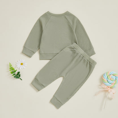 Ensemble haut et pantalon de bébé de couleur unie