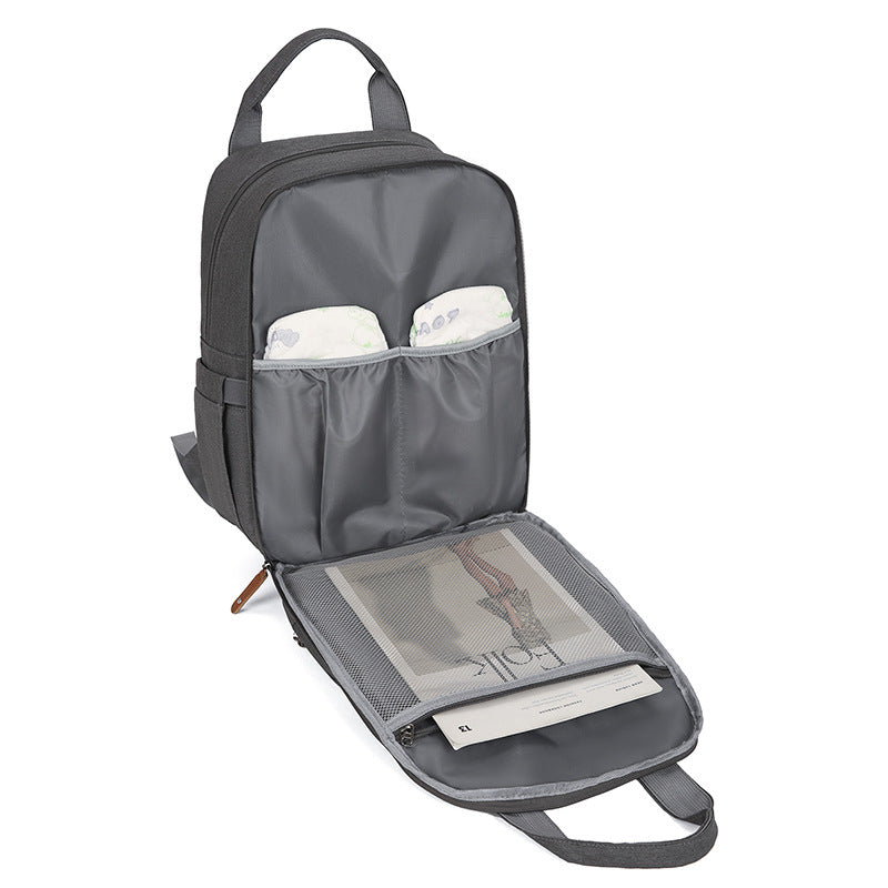 Sac à langer multifonctionnel avec matelas à langer et compartiment chauffant