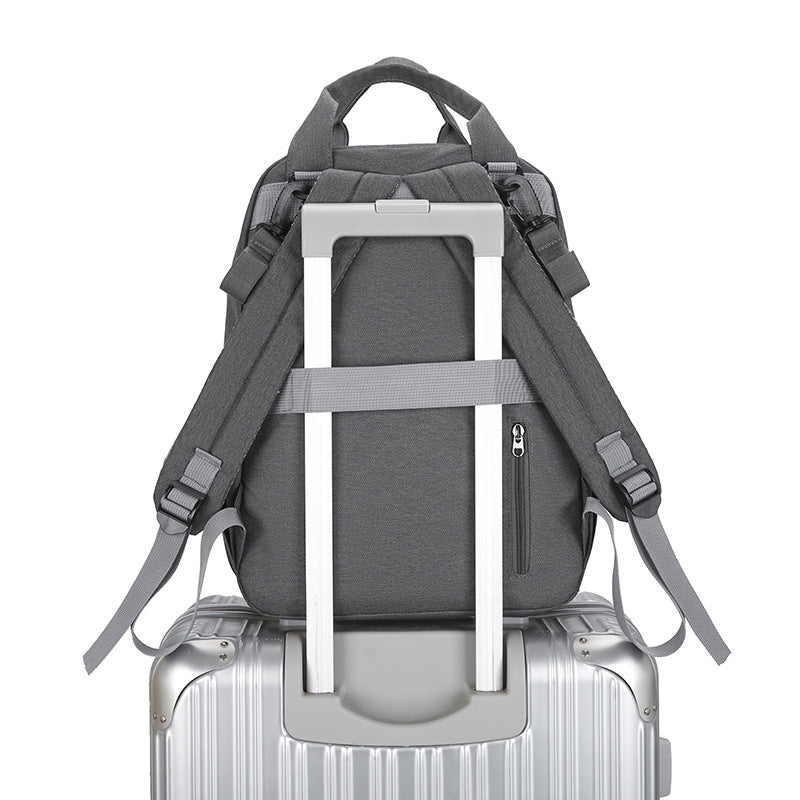 Sac à langer multifonctionnel avec matelas à langer et compartiment chauffant