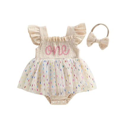 Barboteuse en maille pour filles et bébés avec une jupe en tulle et un nœud